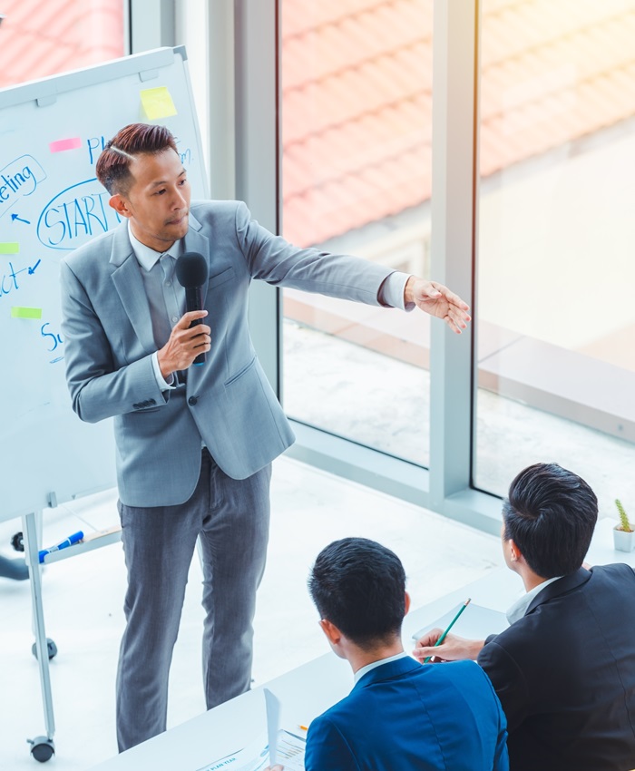 Asian Business men trainer giving presentation at conference